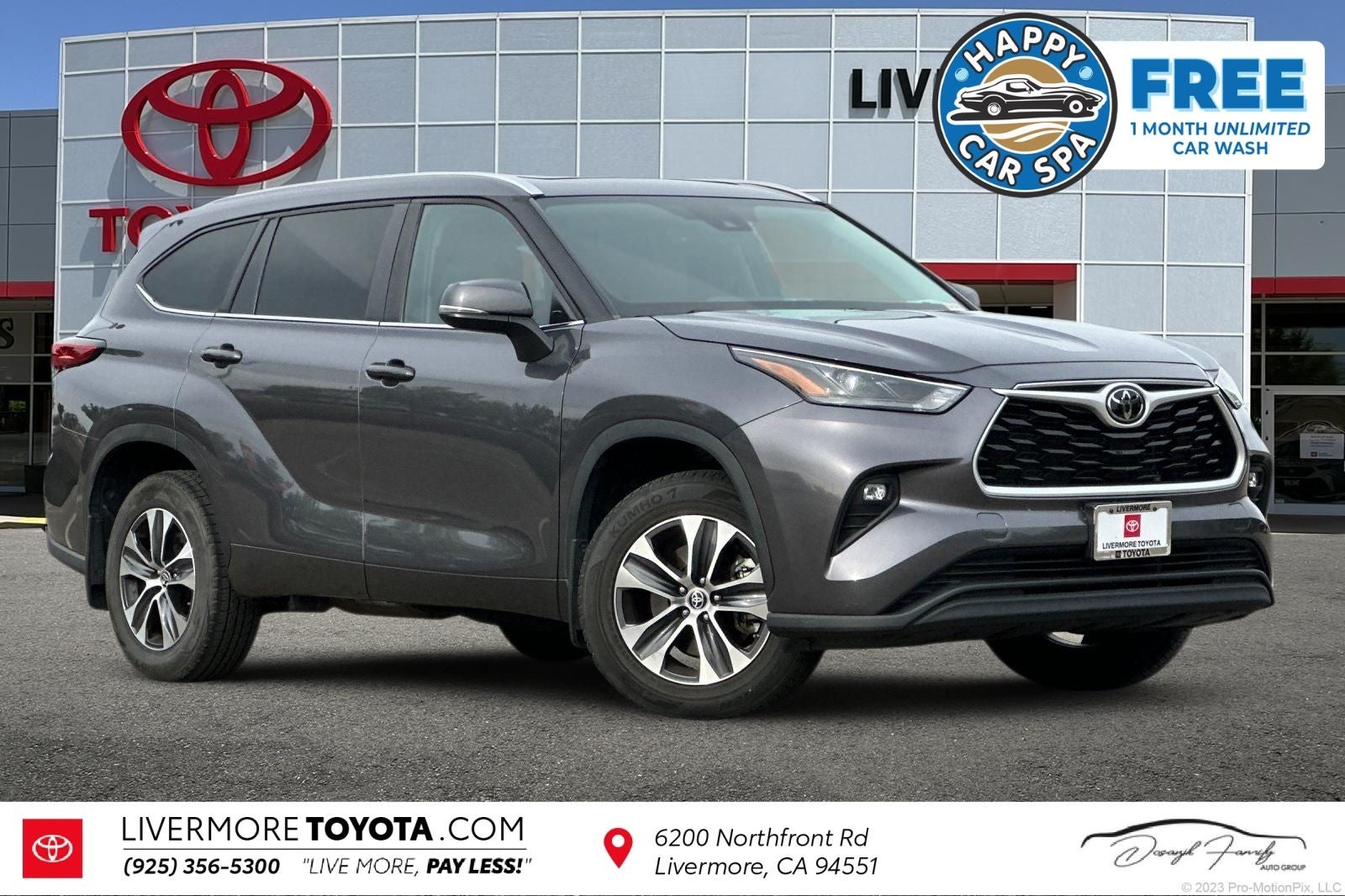 2023 Toyota Highlander XLE in Magnetic Gray Metallic — front three-quarter view