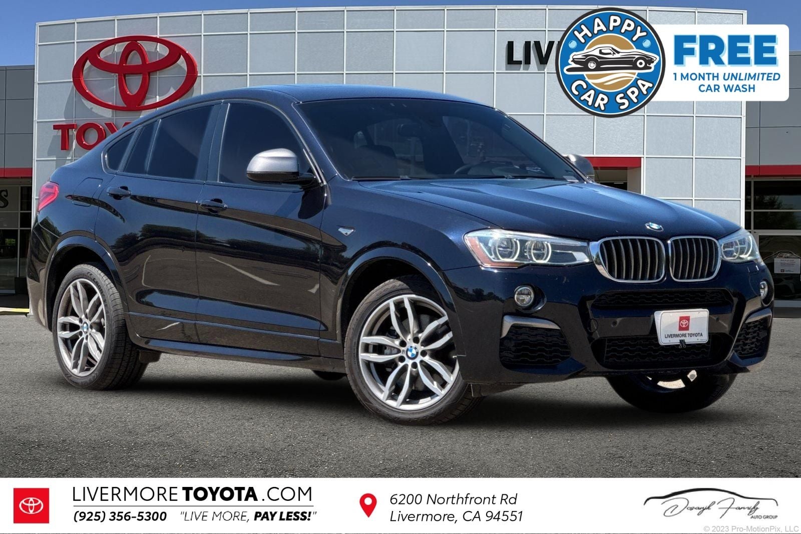 2017 BMW X4 M40i in Carbon Black Metallic — front three-quarter view