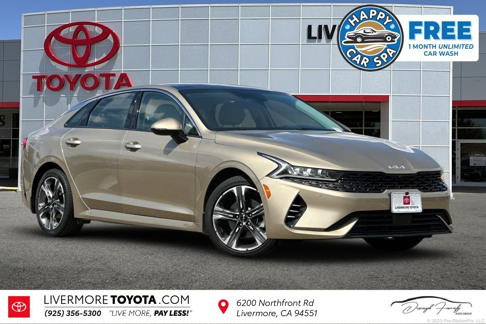 2022 Kia K5 EX in Crystal Beige — front three-quarter view