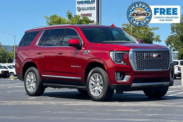 2024 GMC Yukon Denali in Volcanic Red Tintcoat — front three-quarter view