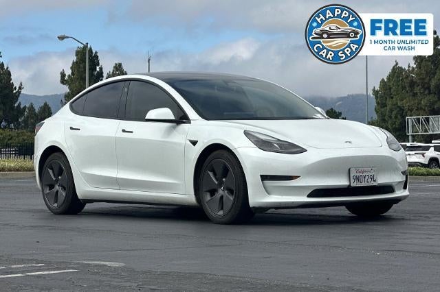 2023 Tesla Model 3 Base in White — front three-quarter view