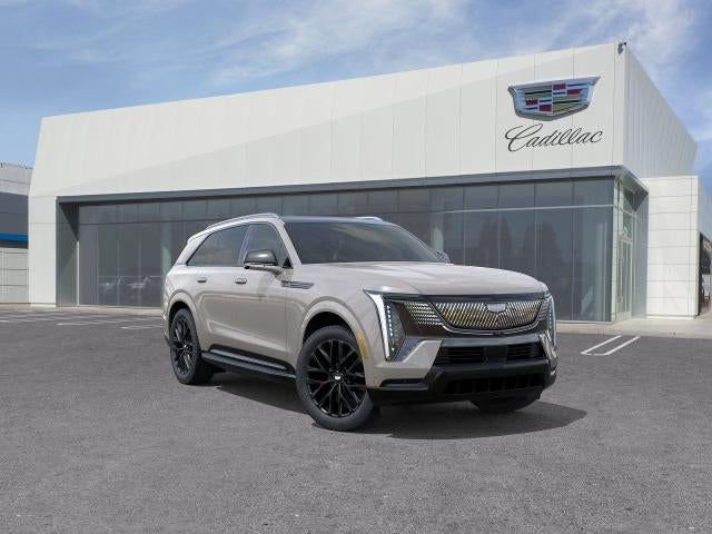 2026 Cadillac ESCALADE IQ Sport in Sandstone — front three-quarter view